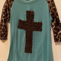 TEAL SHIRT WITH BROWN CROSS